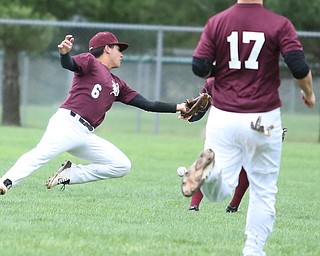 Boardman outfielder Alex Cordona(6) misses the ball as first baseman Evan Kraus(17) watches on during the 1st inning as Boardman takes on Poland, Tuesday, May 2, 2017 at Cene Park. ..(Nikos Frazier | The Vindicator)..