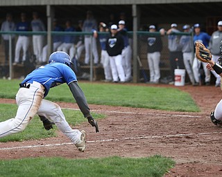 Poland runner Don Drummond(2) gets ready to dive for home as Boardman catcher Coleman Stauffer(20) during the 2nd inning as Boardman takes on Poland, Tuesday, May 2, 2017 at Cene Park. ..(Nikos Frazier | The Vindicator)..