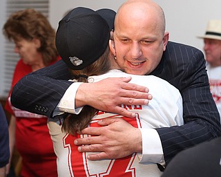 a supporter hugs Dominic Leone III as he is declared the winner at the St. Anthony's Hall, Tuesday, May 2, 2017 in Struthers. (Nikos Frazier | The Vindicator)