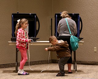 Ryan(5) McElroy and sister, Lauren(8) play with "I voted" stickers while their mom, Ashley McElroy votes at St. Christine Parish Center, Tuesday, May 2, 2017 in Youngstown. ..(Nikos Frazier | The Vindicator)..