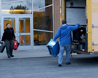 Deputy Stephanie Harchar(left) brings a ballot box to the Board of Elections box truck as Nick Sharpe(right) loads two at St. Christine Parish Center, Tuesday, May 2, 2017 in Youngstown. ..(Nikos Frazier | The Vindicator)..
