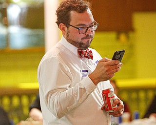 ROBERT K. YOSAY | THE VINDICATOR..Mike Ray... checks results on his phone as the tide started to change.. against him