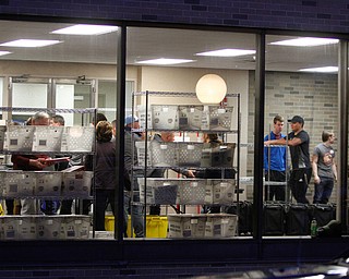       ROBERT K. YOSAY  | THE VINDICATOR..seperating the machines and voting supplies ....rolling in as voting results are trucked in to the Mahoning Valley Election headquarters. at Oak Hill Renissance