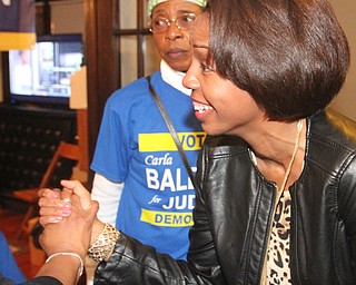 William D. Lewis the vindicator Carla Baldwin gets congrats during vicotry party. In background is Deloris thompson and friend and supporter.