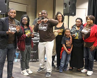 William D. Lewis the vindicator Tito Brown reacts to news he won mayoral primary. With him are family members from left, son Aaron daughter Clarisa, wife Lynette, son Quentin and daughter Camille. and mother Bernice.