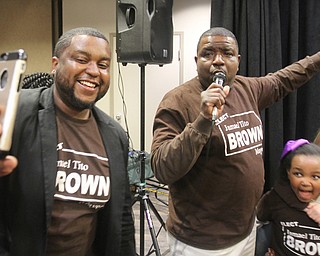 William D. Lewis the vindicator Tito Brown reacts to news he won mayoral primary. At left is his son Aaron.