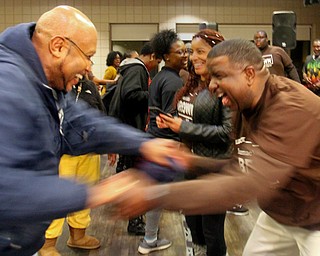 William D. Lewis the vindicator Tito Brown , right, and Rev Kenneth Simon celbrate after Brown won mayoral primary election.