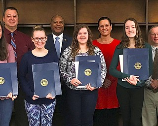 SPECIAL TO THE VINDICATOR
Five members of Girl Scout Troop 80344, who attend McDonald High School, recently received the Gold Level President’s Volunteer Service Award for community service. Student and adult members of the troop contributed 2,284 hours of community service last year. Earning the award were Rachel Ward, Rachel Mathews, Abriella Gillespie, Abigail Sampson and Megan Ward. Rachel and Megan Ward each contributed more than 250 hours of community service. An award ceremony took place at the high school March 20 with Glenn Holmes, state representative; Thomas Domitrovich, village administrator of McDonald; Darlene Smiley-Masetta, pastor of Woodland Park United Methodist Church; and Gary Carkido, principal of McDonald High School. Troop leaders Candice Ward and Lori Gillespie presented the awards, which included the Gold Level Service Pin, a letter signed by former President Barack Obama, and a service recognition certificate. The students were recognized by the Ohio House of Representatives, Ohio Senate and the U.S. House of Representatives with certificates given by Holmes, Carkido on behalf of state Sen. O’Brien, and Domitrovitch on behalf of U.S. Rep. Tim Ryan. From left, are Lori Gillespie, Sampson, Carkido, Mathews, Holmes, Rachel Ward, Smiley-Masetta, Abriella Gillespie, Domitrovich, Megan Ward and Candice Ward.