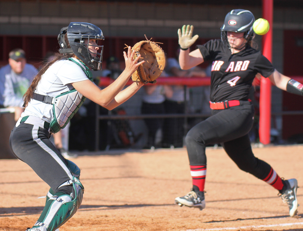 William D. Lewis the Vindicator Girard's Hannah Jones(4) is out at the plate as Uruline catcher Cassie Hanuschak(24) waits for the ball during 5-3-17 game.