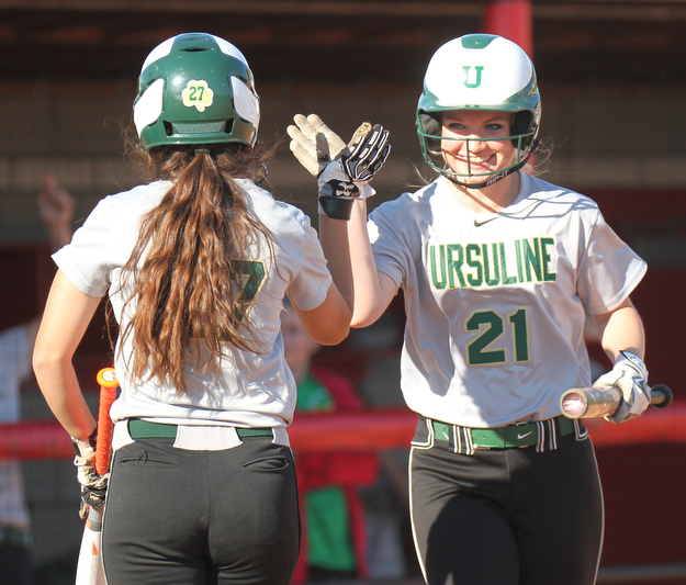 William D. Lewis the Vindicator Ursuline's Cassie Hanuschak(27) gets congrats from Emma Ericson(21) after scoring  during 5-3-17 win over Girard..