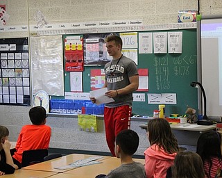 Neighbors | Abby Slanker.Canfield High School sophomore football player, basketball player and track team member Colin Hritz visited C.H. Campbell Elementary School during the school’s annual Read-a-Thon to read “Franklin Plays the Game” to Heather Bruno’s first-grade class on March 20.