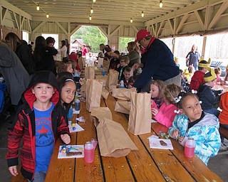 Neighbors | Alexis Bartolomucci.Students got a chocolate Easter Bunny and a drink after going on their egg hunt on April 5 at Boardman Park.