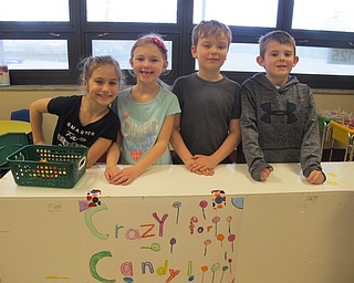 Neighbors | Alexis Bartolomucci.Second-grade students worked the Crazy for Candy booth at the student-run carnival at Stadium Drive Elementary on April 4-7. Pictured are, from left, Carley, Lauren, Oliver and Jessen.