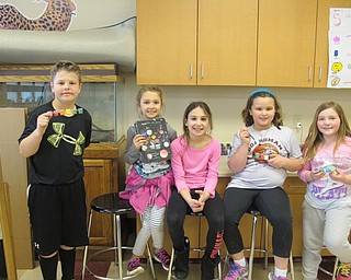 Neighbors | Alexis Bartolomucci.Students had a face-painting area set up at the Carnival of Fun at Stadium Drive Elementary on April 4-7. Pictured are, from left, Jayse, Ella, Gisella, Emma and Ashlyn.