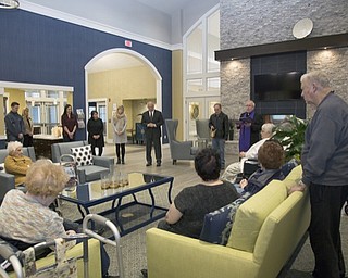 Neighbors | Submitted.Staff and residents gathered in the Great Room of The Inn at Poland Way for a blessing from Monsignor William J. Connell of Holy Family Parish on April 7.