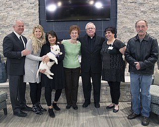 Neighbors | Submitted.Everyone gathered at the Inn at Poland Way after the Blessing of the Inn on April 7. Pictured are, from left, Edward J. Reese, CEO of EDM Management Inc.; Diane Reese, president of EDM Management Inc.; Debbie Lepore, executive director at The Inn at Poland Way; Cooper; Pat Lee, president of the Resident Council at The Inn at Poland Way; Monsignor William J. Connell; Kathy Boosinger, activities director at The Inn at Poland Way; and Bob Renninger, Holy Family Parish.