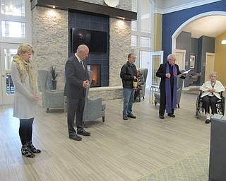 Neighbors | Alexis Bartolomucci.Monsignor WIlliam J. Connell said a prayer before he performed his blessing of the Inn at Poland Way on April 7.