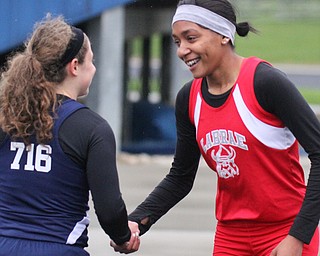 William D Lewis The Vindicator LaBrae's Dynesty Ervin gets congrats from JFK's Antonella LaMonica after winning.  LaMonica was 2nd during TrumbullTrack Meet at Lakeview 5-4-17