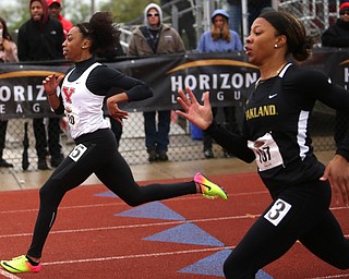 Taylor Thompkins(220) of Youngstown State, competes in the Women's 200 meter dash during a Horizon League Track and Field Championship at Farmers National Bank Field, Saturday, May 6, 2017 in Youngstown.  .Sydney Sterling(107) of Oakland crosses the finish line behind her...(Nikos Frazier | The Vindicator)