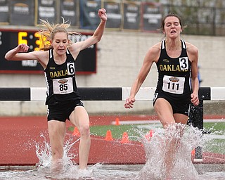 Ashley Burr(85) and Kailey Weingartz(111) of Oakland, compete in the Women's 3000 meter steeplechase during a Horizon League Track and Field Championship at Farmers National Bank Field, Saturday, May 6, 2017 in Youngstown.  ..(Nikos Frazier | The Vindicator)