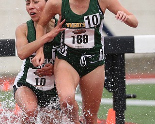 Karen Barrientos(10) of Cleveland State falls onto Hailey Brumfield(169) of Wright State while competing in the Women's 3000 meter steeplechase during a Horizon League Track and Field Championship at Farmers National Bank Field, Saturday, May 6, 2017 in Youngstown.  ..(Nikos Frazier | The Vindicator)