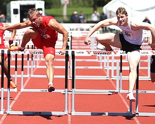 Chad Zallow(429) of Youngstown State and Nate Pozolinski(384) of Milwaukee, compete in the men's 110 meter hurdle final during the final day of the Horizon League Track & Field Championships at Farmers National Bank Field at Youngstown State, Sunday, May 7, 2017 in Youngstown.  Zallow placed first with a time of 13.782. ..(Nikos Frazier | The Vindicator)