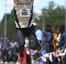 Brandon Davis(305) of Oakland, competes in the men's triple jump final during the final day of the Horizon League Track & Field Championships at Farmers National Bank Field at Youngstown State, Sunday, May 7, 2017 in Youngstown.  ..(Nikos Frazier | The Vindicator)