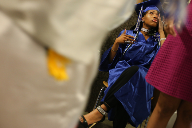 Caprice Stevens wipes away tears as her classmates line up to walk during the Youngstown Early College graduation at Ford Recital Hall at DeYor Performing Arts Center, Sunday, May 7, 2017 in Youngstown. ..(Nikos Frazier | The Vindicator)