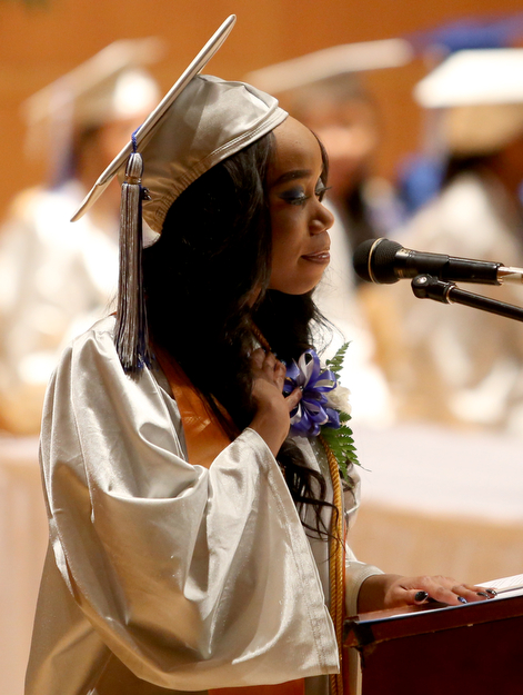 Victoria Graham wipes away tears while thanking her parents during her valedictorian speech at the Youngstown Early College graduation at Ford Recital Hall at DeYor Performing Arts Center, Sunday, May 7, 2017 in Youngstown. ..(Nikos Frazier | The Vindicator)