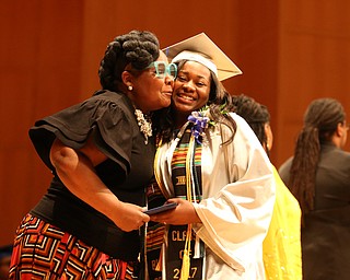 Dionne Trammell hugs Dean Monica Jones after receiving her high school diploma from Youngstown Early College graduation at Ford Recital Hall at DeYor Performing Arts Center, Sunday, May 7, 2017 in Youngstown. ..(Nikos Frazier | The Vindicator)