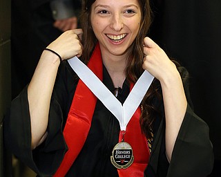 MICHAEL G TAYLOR | THE VINDICATOR- 05-06-17 Youngstown State University (YSU) Commencement at Beeghly Center on YSU campus. Jenna Wise of Hubbard, STEM, Science and Computer major graduate, prepares herself fot the Commencement