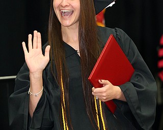 MICHAEL G TAYLOR | THE VINDICATOR- 05-06-17 Youngstown State University (YSU) Commencement at Beeghly Center on YSU campus. Graduate waves to her father.