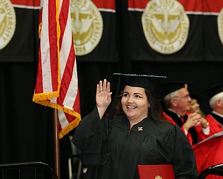 MICHAEL G TAYLOR | THE VINDICATOR- 05-06-17 Youngstown State University (YSU) Commencement at Beeghly Center on YSU campus. Graduate waves to her family.
