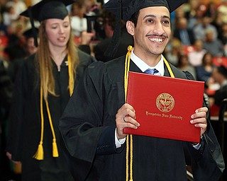 MICHAEL G TAYLOR | THE VINDICATOR- 05-06-17 Youngstown State University (YSU) Commencement at Beeghly Center on YSU campus. Graduate smiles to his family.