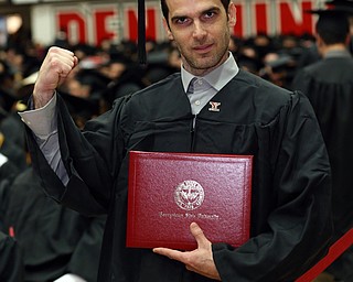 MICHAEL G TAYLOR | THE VINDICATOR- 05-06-17 Youngstown State University (YSU) Commencement at Beeghly Center on YSU campus. Jim Harrison from Hubbard, OH., fist pumps after receiving his diploma.