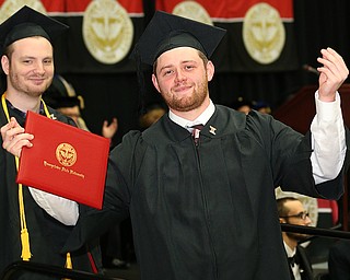 MICHAEL G TAYLOR | THE VINDICATOR- 05-06-17 Youngstown State University (YSU) Commencement at Beeghly Center on YSU campus. Adam Vincent Jr. from Canfield, OH., raises his arms after receiving his diploma.