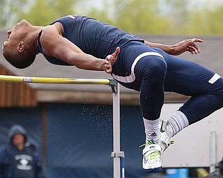 MICHAEL G TAYLOR | THE VINDICATOR- 05-06-17  37th Annual Optimist High School Invitational Track Meet in Austintown, OH at Austintown High School. Austintown's Jakari Lumsden attempts to clear the high bar. Austintown's Jakari Lumsden won the event in a jump off.