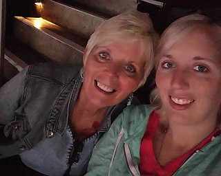 Cindy Stoughton relaxes with her daughter, Elizabeth Serensky, both of Hanoverton.