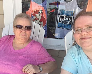 Peggy Brewer of Girard, sits with her daughter, Lisa Kuty, in a more recent photo with a now grown up Lisa, right.