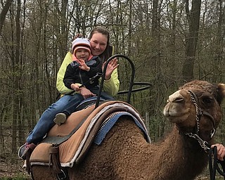 Michelle and Hunter Martin of Poland take a camel ride.