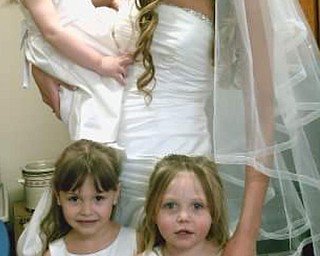 Lisa Ray spends precious moments with her daughters. They live in Vickery, Ohio.