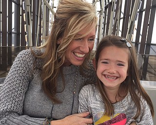 Sara Sinchak of Boardman, embraces her daughter, Nina.