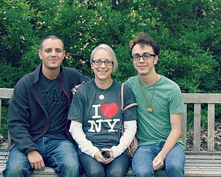 Mark Phillips, left, and Isaac Beach enjoy some outdoor time with mom, Darla Beach. All are from Girard.