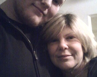 Jason Bieber of North Lima hugs his mom, Maribeth Bieber, also of North Lima.