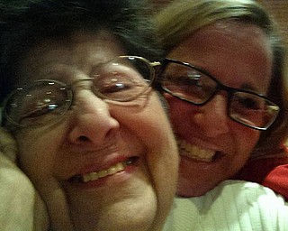 Getting a big squeeze from her daughter, Lucille Mazzocca, is Mary Mazzocca. Both are from Campbell.