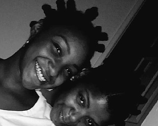 Tiffany Dorsey and her daughter, Destiny McElroy, both of Warren, enjoy each other’s company.