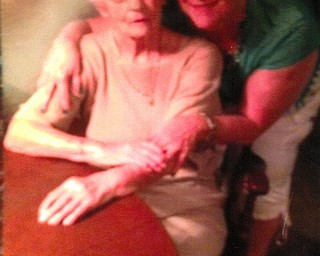 Helen Stabile of Niles enjoys a big hug from her daughter, Deborah Stabile of Youngstown.
