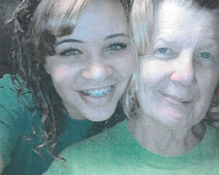 Cassidy Marie Ross looks as if she’s photo-bombing her mom, Jo Ross of Columbiana.