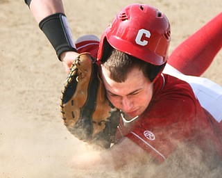William D Lewis The Vindicator  Columbiana's AJ Perkins(33) gets back to first safe during a pickoff attempt. Crestview 's Devin Turvey tries to make the tag.