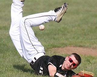William D Lewis The Vindicator   Crestview's Dylan Ball(17) tkes a tumble while trying to catch a foul ball off Columbiana's Keenan Green(8) during 5-10-17 game at Columbiana.
